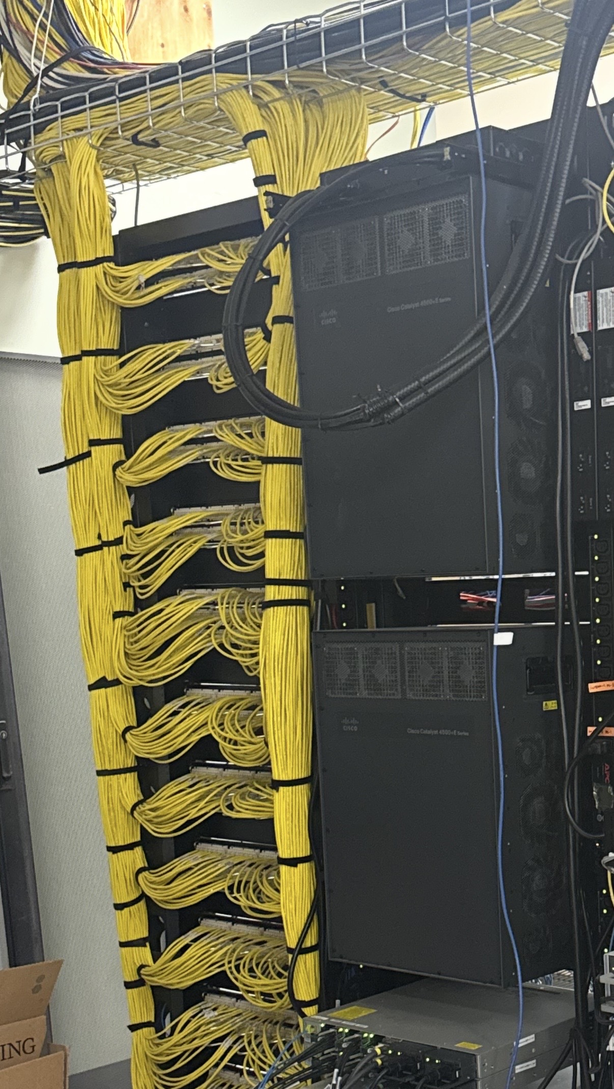 Large server room with organized yellow structured network cabling in Edmonton