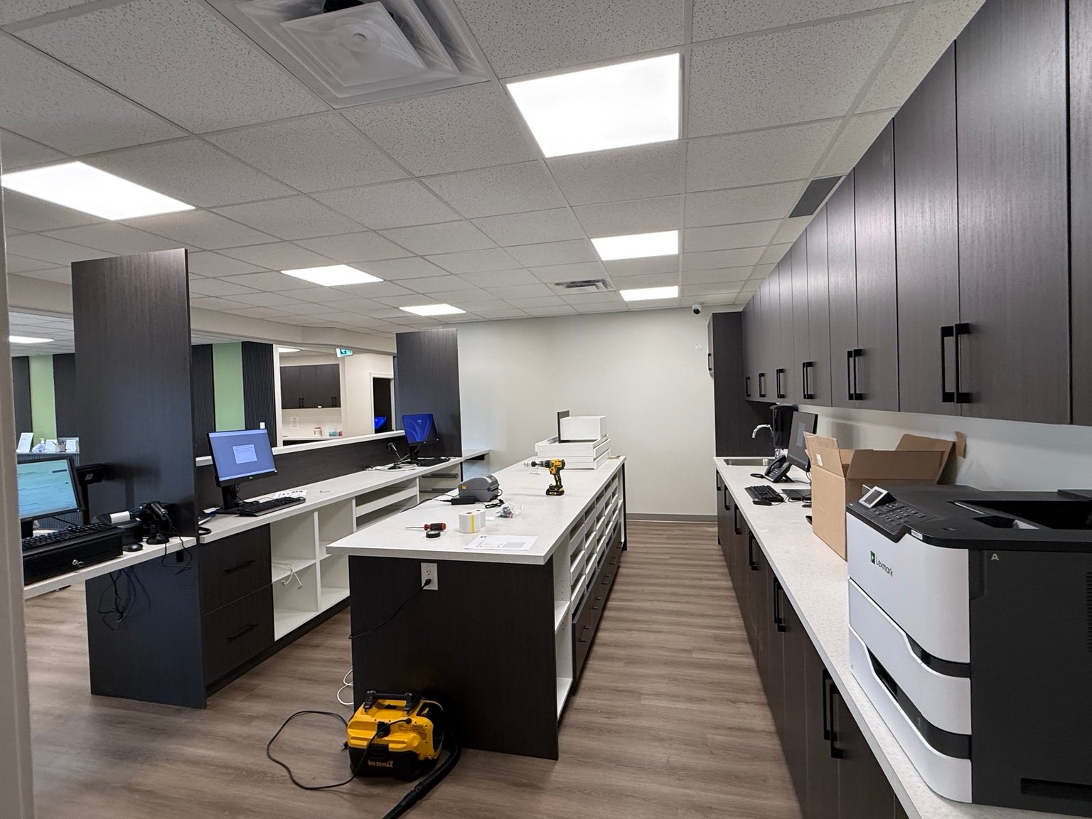 Commercial workspace with desktop workstations and multifunction printer