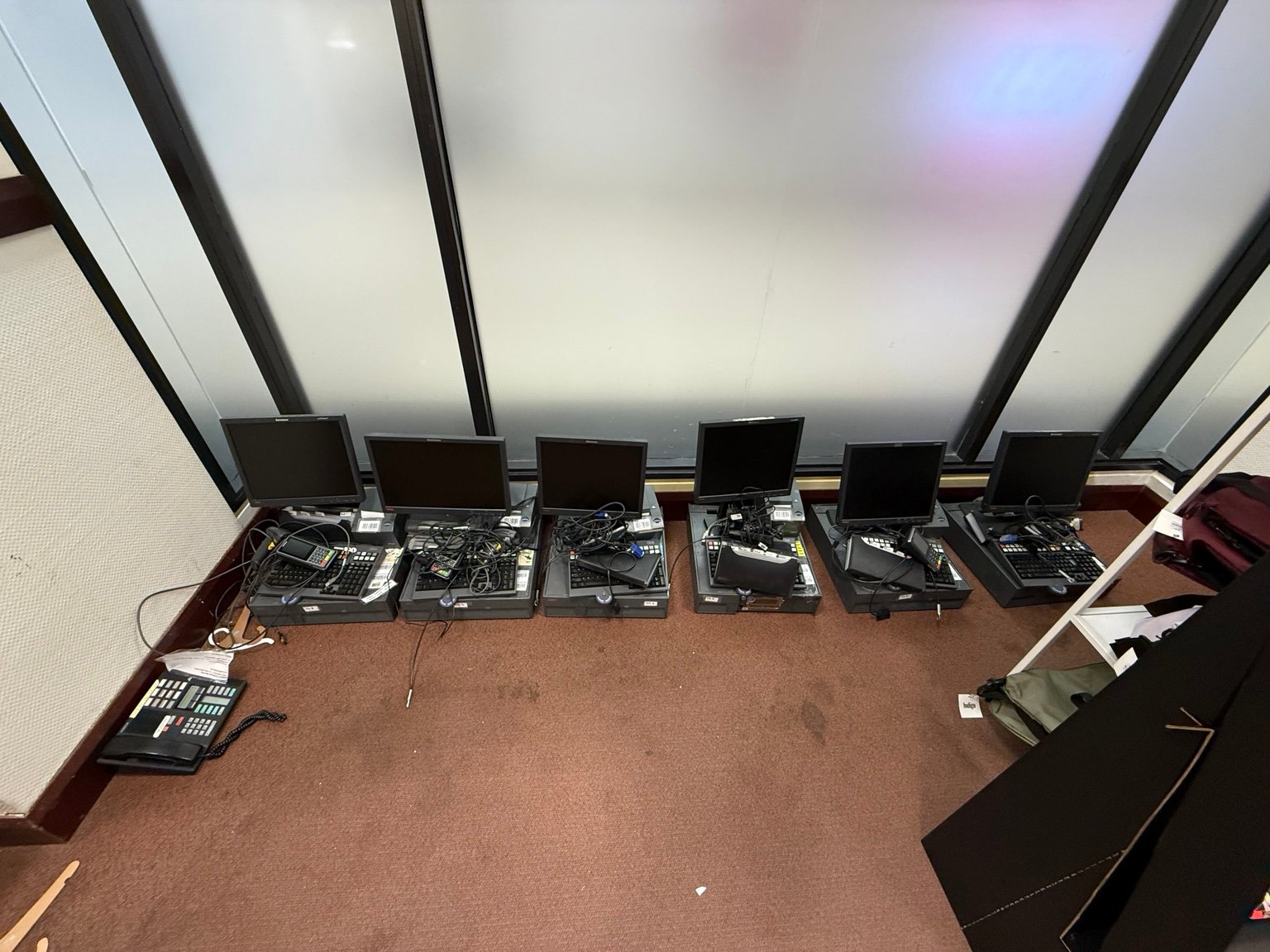 POS workstation components arranged for setup with visible counter wiring