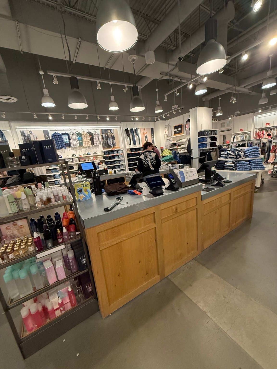 Retail checkout counter showing point-of-sale workstations and peripherals