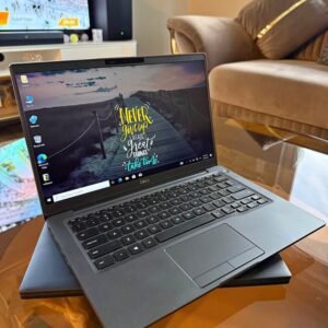 Black Dell Latitude 7400 14-inch laptop open on a glass table
