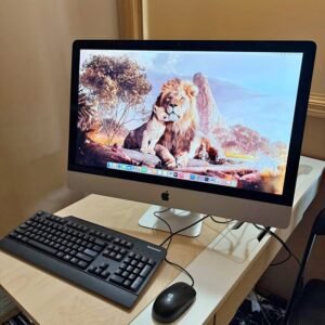 Apple iMac Retina 2017 on a desk with keyboard and mouse
