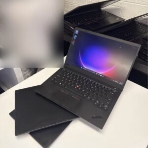 Lenovo ThinkPad X1 Carbon laptop open on a white table