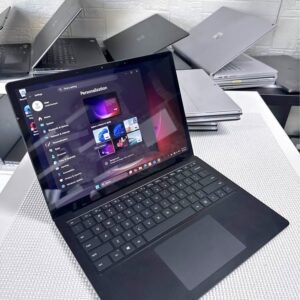 Black Microsoft Surface Laptop 4 open showing Windows 11 settings