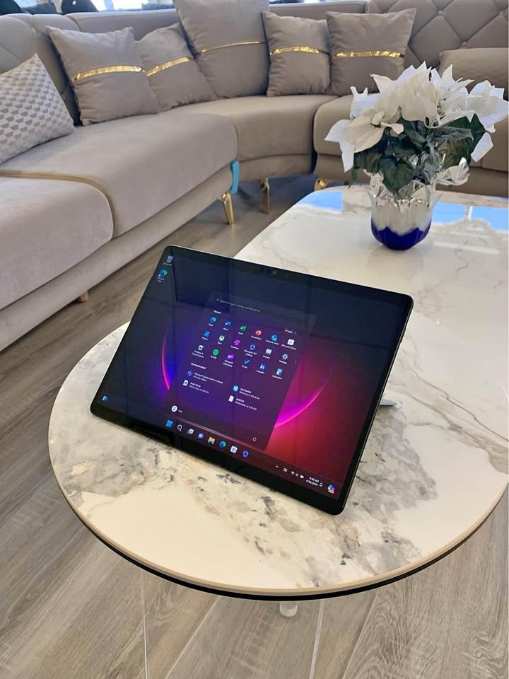 Microsoft Surface Pro 8 on a table with Windows 11 start menu open